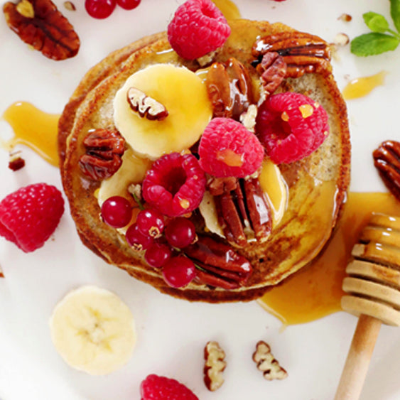 Banana Buckwheat Pancakes with Raspberries & Manuka Honey
